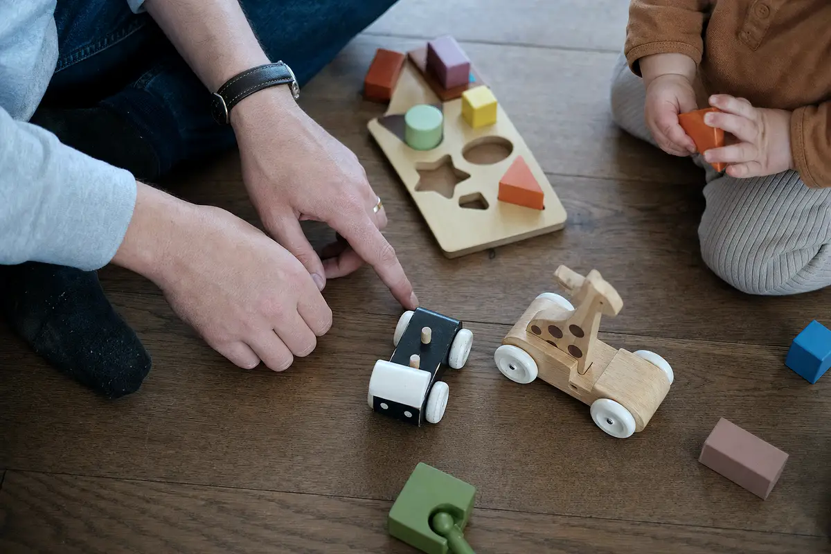 Toys on the floor during quiet play at home.